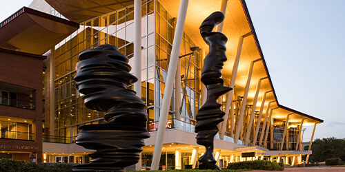 Exterior of the Hobby Center building and the statues that are in front