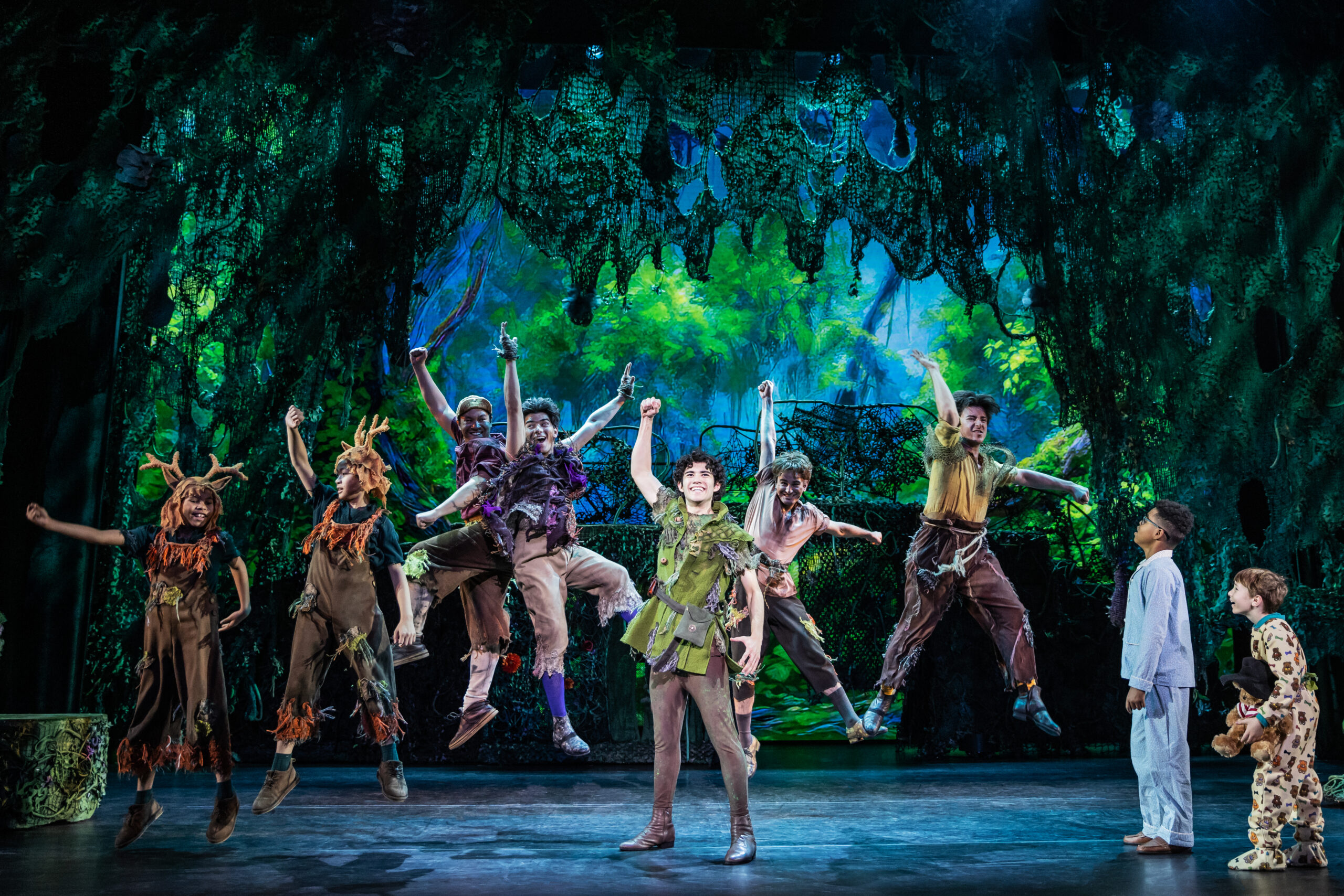 Nolan Almeida as Peter Pan (center) and the cast of Peter Pan