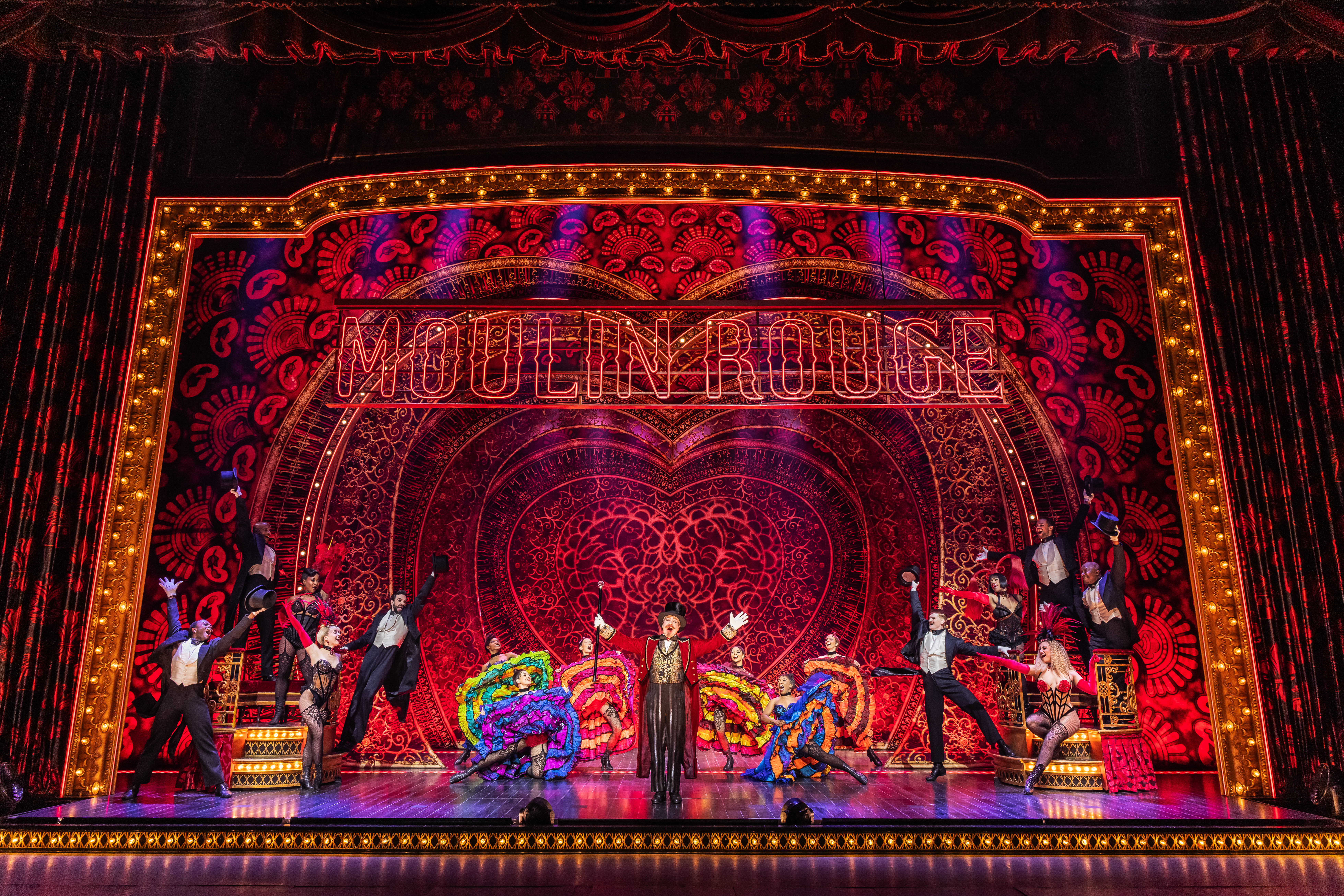 Robert Petkoff and the Company of the 2025 touring production of MOULIN ROUGE! THE MUSICAL
