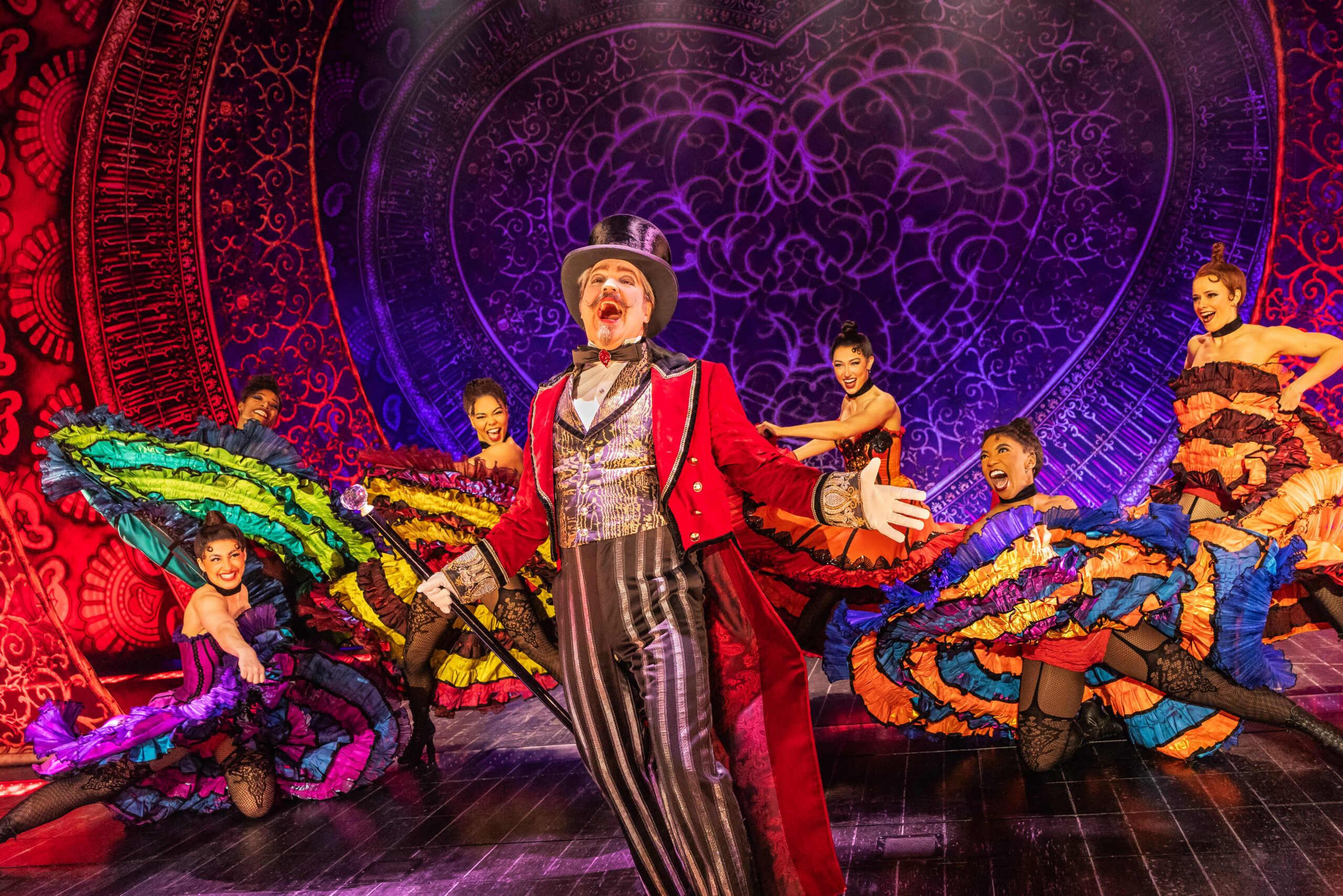 Robert Petkoff and the Company of the 2025 touring production of MOULIN ROUGE! THE MUSICAL